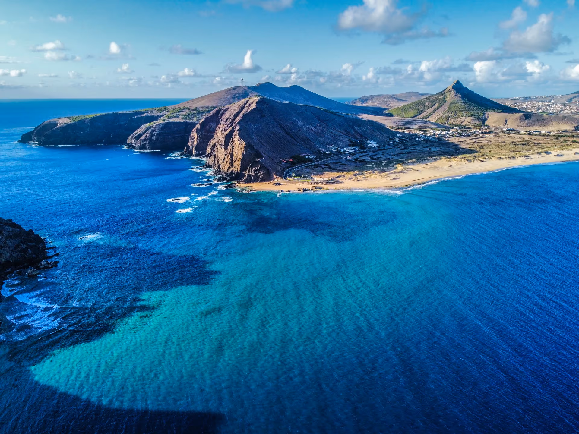 The long golden beach of Porto Santo meeting a calm Atlantic