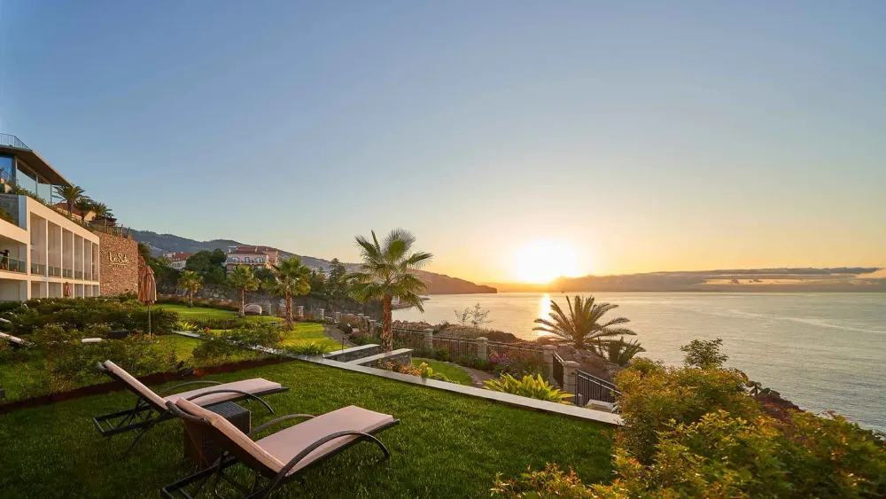 Infinity pool meeting the Atlantic horizon at Les Suites at The Cliff Bay, Funchal, Madeira
