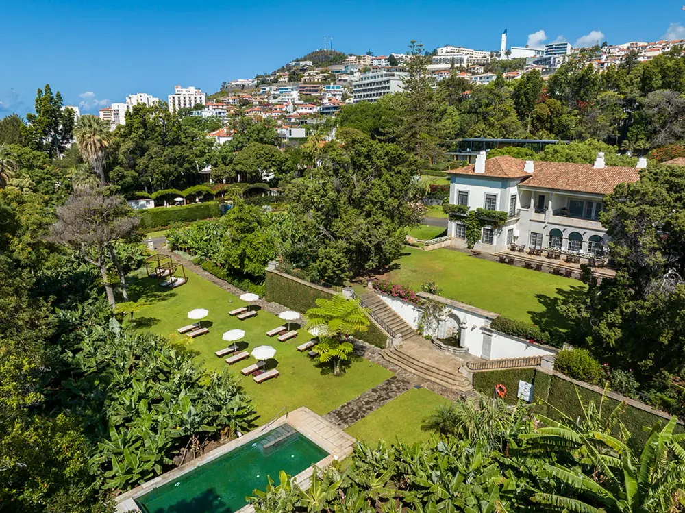 Garden pavilion room opening onto subtropical grounds at Quinta da Casa Branca, Funchal, Madeira