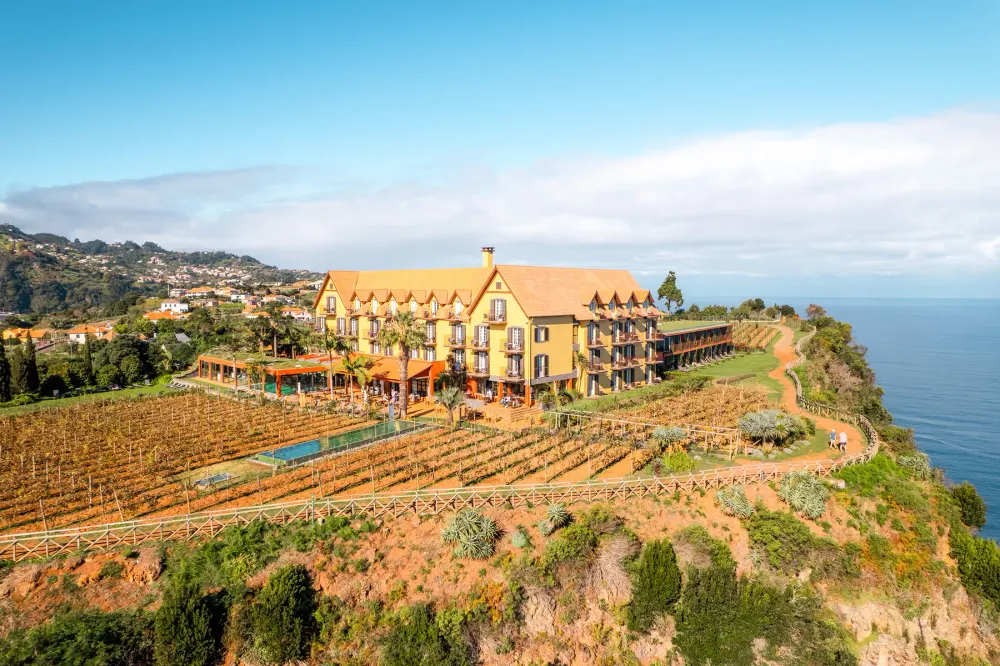 Clifftop lawn and vineyard of Quinta do Furão above the Atlantic near Santana, Madeira