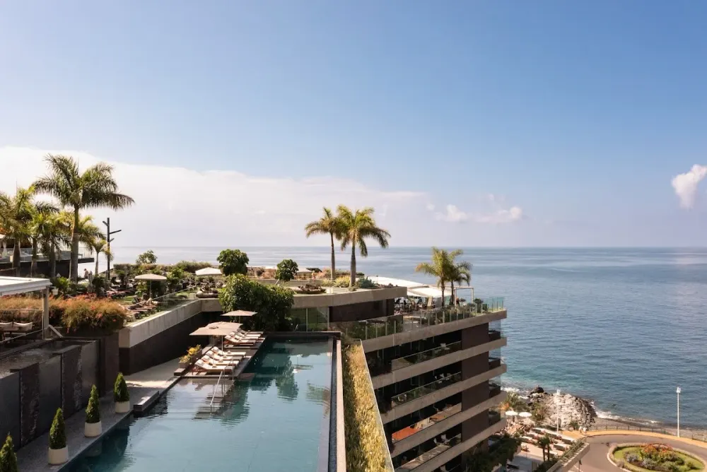 West-facing rooftop pool at Saccharum Resort above the Calheta marina, Madeira
