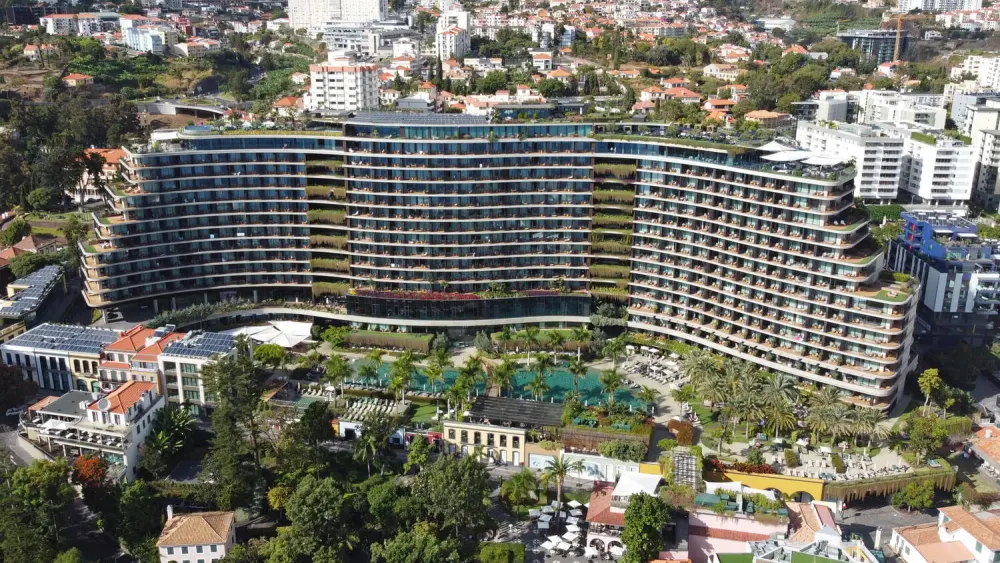 Curved facade and pool deck of the Savoy Palace hotel on the Funchal seafront, Madeira