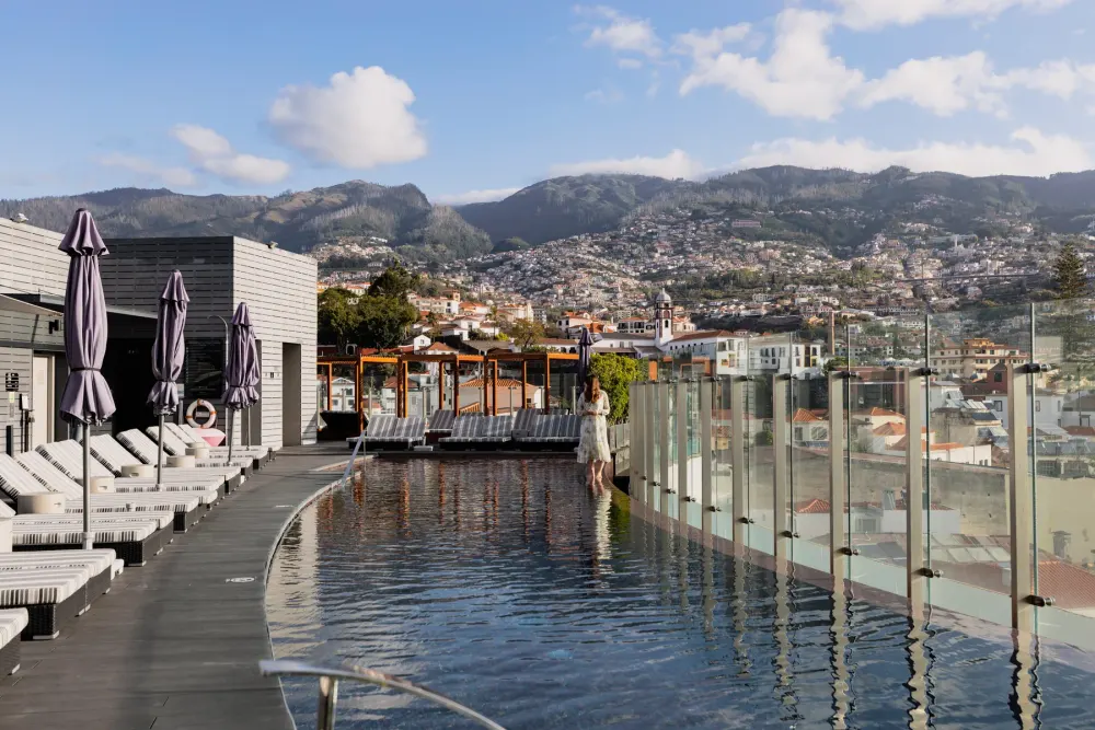 Rooftop pool of The Vine hotel with a 360-degree view over central Funchal, Madeira